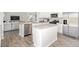 Open concept kitchen features granite countertops, stainless appliances, and leads to living area at 2739 Luxborough Ln, Mebane, NC 27302