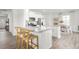 Bright kitchen with white cabinets, granite countertops, stainless steel appliances, and bar seating at 2739 Luxborough Ln, Mebane, NC 27302