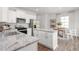 Well-appointed kitchen features granite countertops, stainless steel appliances, and breakfast nook at 2739 Luxborough Ln, Mebane, NC 27302