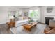 Inviting living room with a comfortable sectional sofa, a fireplace, and hardwood floors at 2739 Luxborough Ln, Mebane, NC 27302