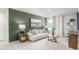 Comfortable living room features an accent wall, sofa, artwork, and stylish decor at 2739 Luxborough Ln, Mebane, NC 27302