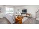 Bright living room with a comfortable sofa, modern decor, and large windows at 2739 Luxborough Ln, Mebane, NC 27302
