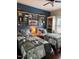 Cozy bedroom with two twin beds, stylish decor, and ample shelving at 2747 Beasley, Benson, NC 27504