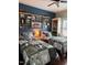 Rustic bedroom with twin beds, shelving, and cowboy-themed decor at 2747 Beasley, Benson, NC 27504