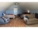 Comfortable upstairs bedroom with multiple beds, a cozy couch, and ample natural light at 2747 Beasley, Benson, NC 27504