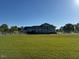 View of a single-story home with a well-manicured lawn at 2747 Beasley, Benson, NC 27504