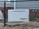 View of Generac generator behind chain link fence at 2747 Beasley, Benson, NC 27504