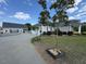 Well-maintained building exterior with paved parking and grassy yard at 2747 Beasley, Benson, NC 27504
