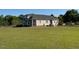 Side view of home with a large lawn and horse fencing at 2747 Beasley, Benson, NC 27504