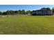 Large lawn, fenced horse property, and charming home with front porch at 2747 Beasley, Benson, NC 27504
