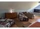 Open attic living space with beds, seating, and natural light at 2747 Beasley, Benson, NC 27504