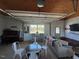 Versatile garage space transformed into a comfortable living area with dining, kitchen, and seating at 2747 Beasley, Benson, NC 27504