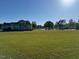 View of a pond from the house with a large lawn in the foreground at 2747 Beasley, Benson, NC 27504