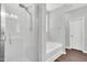 Bathroom featuring glass enclosed shower and a soaking tub at 2784 Norrington Rd, Lillington, NC 27546