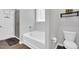 Bathroom with shower, soaking tub and toilet with tile flooring at 2784 Norrington Rd, Lillington, NC 27546
