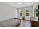 Bedroom featuring hard wood floors, a large window with natural light and a dresser at 2784 Norrington Rd, Lillington, NC 27546