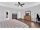 Bedroom with a wooden dresser with a mounted TV on top, offering a cozy atmosphere at 2784 Norrington Rd, Lillington, NC 27546
