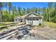 View of home featuring a two-car garage and charming light gray siding at 2784 Norrington Rd, Lillington, NC 27546