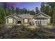 Charming single-story home with stone accents, a two-car garage, and a well-manicured yard at 2784 Norrington Rd, Lillington, NC 27546