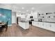 Spacious kitchen featuring white cabinets, black countertops, and stainless steel appliances at 2784 Norrington Rd, Lillington, NC 27546