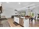 Open-concept living space with kitchen island, dining area and comfortable living room at 2784 Norrington Rd, Lillington, NC 27546