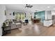 Open-concept living space with stylish decor and ample natural light and an adjacent dining area at 2784 Norrington Rd, Lillington, NC 27546