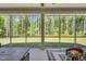 View from screened porch with nature view, furniture, and ' toy at 2784 Norrington Rd, Lillington, NC 27546