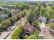 Aerial view of the home in a verdant neighborhood showcasing lush landscaping, mature trees, and close proximity to amenities at 2817 Peachleaf St, Raleigh, NC 27614