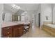 This bathroom has double sinks, a soaking tub, tiled shower, and natural light at 2817 Peachleaf St, Raleigh, NC 27614