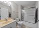 This bathroom has a shower-tub combo, neutral colors, a vanity with storage, and tile floors at 2817 Peachleaf St, Raleigh, NC 27614