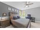 Comfortable bedroom includes a ceiling fan, lots of natural light, neutral carpet, and stylish furniture at 2817 Peachleaf St, Raleigh, NC 27614