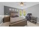 Cozy bedroom includes a ceiling fan, lots of natural light, neutral carpet, and stylish furniture at 2817 Peachleaf St, Raleigh, NC 27614