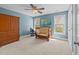 Bright bedroom with wood furniture, ceiling fan, and two windows offering natural light at 2817 Peachleaf St, Raleigh, NC 27614