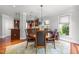 Elegant dining area with wooden table, decorative rug, and natural light at 2817 Peachleaf St, Raleigh, NC 27614
