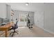 Versatile room perfect for a home office or gym featuring a window and built-in shelves at 2817 Peachleaf St, Raleigh, NC 27614