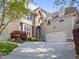 Charming exterior of two-story home with a stone entryway and attached garage on a tree-lined lot at 2817 Peachleaf St, Raleigh, NC 27614