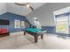Spacious game room with billiard table and large windows at 2817 Peachleaf St, Raleigh, NC 27614