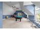 Spacious game room with billiard table, natural light, and blue accent wall at 2817 Peachleaf St, Raleigh, NC 27614