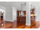 Open concept kitchen with wooden breakfast bar, stainless steel appliances, and access to living area at 2817 Peachleaf St, Raleigh, NC 27614