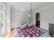 Elegant living room featuring decorative trim, hardwood floors, chandelier, and a bright, open feel at 2817 Peachleaf St, Raleigh, NC 27614