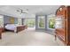 Spacious main bedroom with a tray ceiling, ceiling fan, lots of natural light, and traditional wood furniture at 2817 Peachleaf St, Raleigh, NC 27614