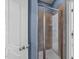 Bathroom shower featuring tiled walls and a glass door at 2817 Peachleaf St, Raleigh, NC 27614