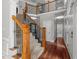 Staircase featuring wooden handrail and wrought iron spindles leading to the second floor at 2817 Peachleaf St, Raleigh, NC 27614