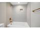 Bathroom with grey tiled shower and bronze fixtures at 313 Crown Oaks Dr, Raleigh, NC 27615
