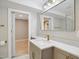 Modern bathroom featuring quartz counters, gray cabinets and gold hardware at 313 Crown Oaks Dr, Raleigh, NC 27615