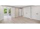 Bright main bedroom leading into a bathroom with a glass shower; hardwood floors and spacious closets present at 313 Crown Oaks Dr, Raleigh, NC 27615