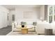 Comfortable living room boasting white sofa, stylish accents, and lots of natural light at 320 Canyon Spring Trl, Wake Forest, NC 27587