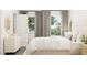 Bedroom filled with natural light with bright accents, large window and neutral decor at 320 Canyon Spring Trl, Wake Forest, NC 27587