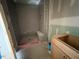 New bathroom with gray tiled shower and unfinished vanity at 348 Inspiration Way, Fuquay Varina, NC 27526