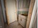 New bathroom with vanity with sleek white cabinets and new door at 348 Inspiration Way, Fuquay Varina, NC 27526